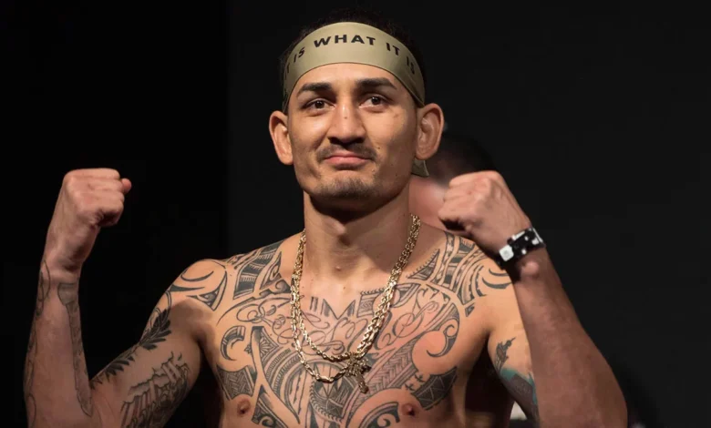 UFC-MMA-Holloway-poses-at-weigh-in